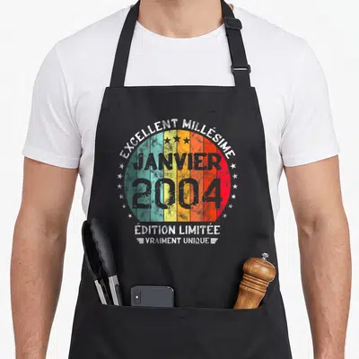 Tablier de cuisine noir avec motif circulaire coloré Excellent Millésime Janvier 2004 « Édition Limitée » Vraiment Unique entouré d'étoiles.