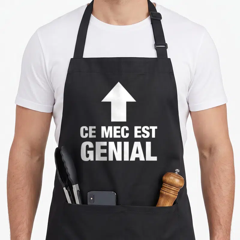 Tablier de cuisine noir avec flèche blanche pointant vers le haut et texte Ce mec est genial en lettres capitales blanches.