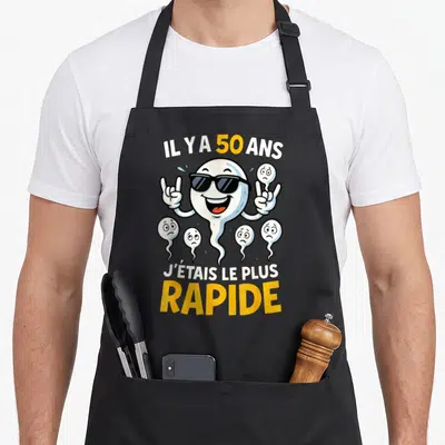 Tablier de cuisine noir avec illustration de spermatozoïde portant des lunettes de soleil et le texte Il y a 50 ans j'étais le plus rapide
