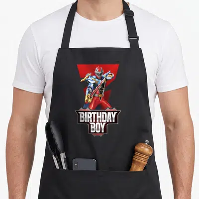 Tablier de cuisine noir avec illustration du Red Ranger Dino Fury et l'inscription anniversaire Boy en lettres blanches et noires.