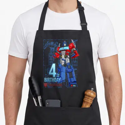 Tablier de cuisine noir avec Optimus Prime et l'inscription 4th anniversaire en bleu clair.