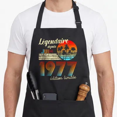 Tablier de cuisine noir avec motif rétro Légendaire depuis juin 1977 et soleil aux palmiers