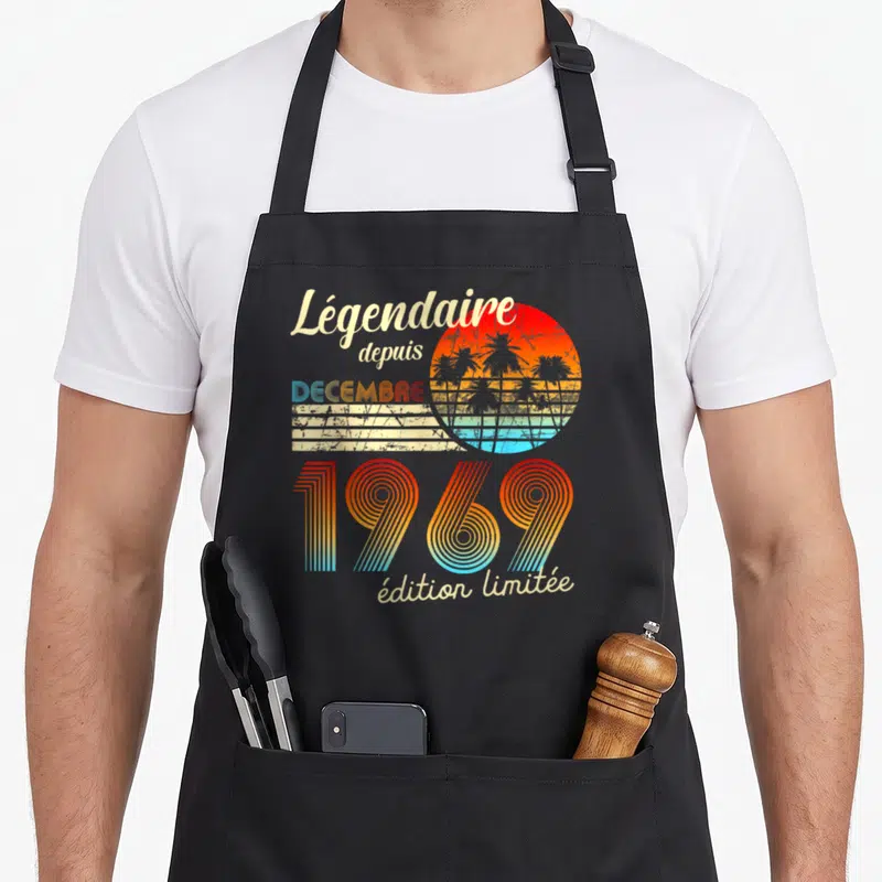 Tablier de cuisine noir avec motif rétro Légendaire depuis 1969 Décembre spécial et soleil aux palmiers.