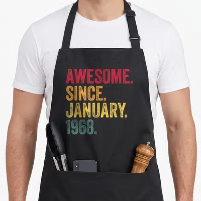 Tablier de cuisine noir avec inscription Génial Depuis Janvier 1968 en lettres colorées vintage rouge orange jaune et turquoise.