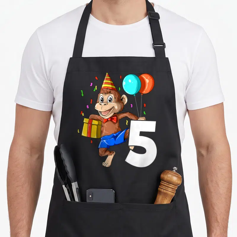 Tablier de cuisine noir avec singe cartoon chapeau pointu cadeau et chiffres cinq.