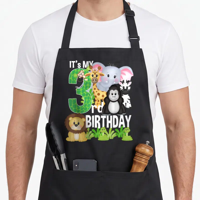 Tablier de cuisine noir avec illustration d'animaux de zoo et texte It's My 3rd anniversaire Party imprimé en couleur.