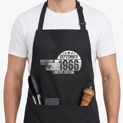 Tablier de cuisine noir avec motif rétro blanc mentioning September 1966 et Limited Edition.