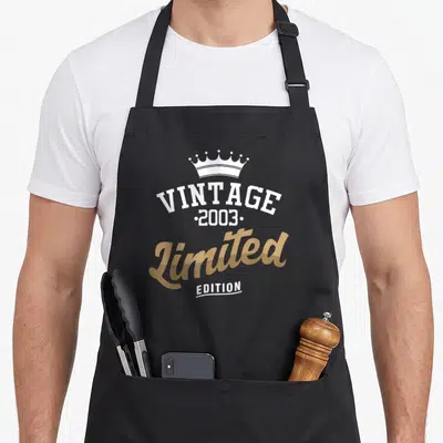 Tablier de cuisine noir avec motif vintage 2003 limited edition couronne blanche et texte doré