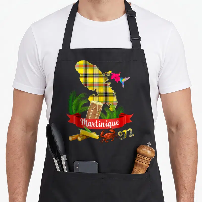 Tablier de cuisine noir avec carte Martinique madras, colibri, hibiscus, tambourin, cannes à sucre, crabe et inscription 972.