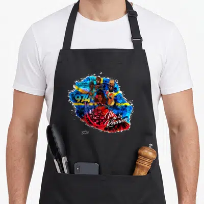 Tablier de cuisine noir avec une illustration colorée représentant l'île de la Réunion et des personnages musicaux.