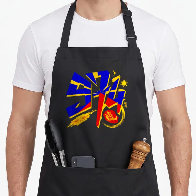 Tablier de cuisine noir avec le chiffre 974 stylisé aux couleurs du drapeau et les mots Île de la Réunion.