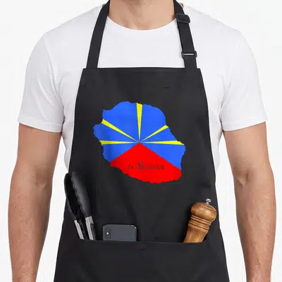 Tablier de cuisine noir avec carte de La Réunion aux couleurs du drapeau et texte la Réunion en blanc.
