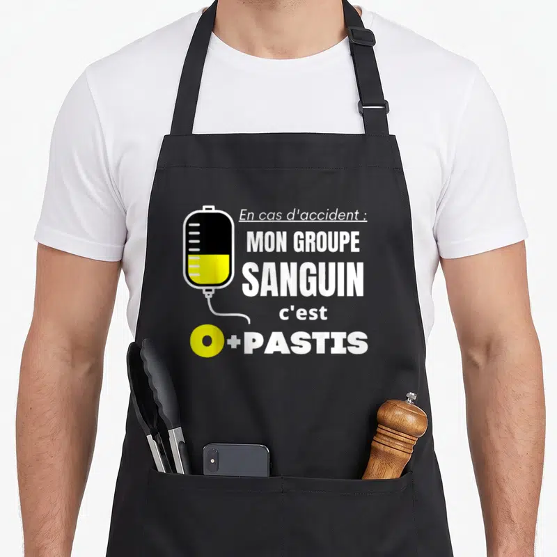 Tablier de cuisine noir avec illustration de perfusion et texte En cas d'accident mon groupe sanguin c'est O plus Pastis