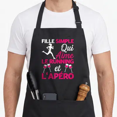 Tablier de cuisine noir avec silhouette de femme courant et texte Fille Simple Qui Aime Le Running Et L'Apéro en blanc et rose.