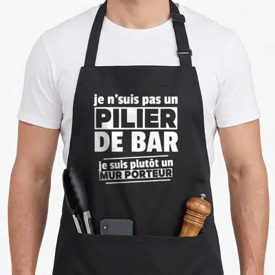 Tablier de cuisine noir avec le texte blanc je n'suis pas un pilier de bar je suis plutôt un mur porteur