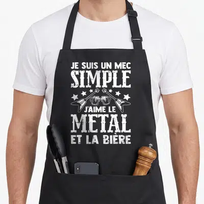 Tablier de cuisine noir avec inscription blanche Je Suis Un Mec Simple J'aime Le Metal Et La Bière et illustration de guitares croisées.