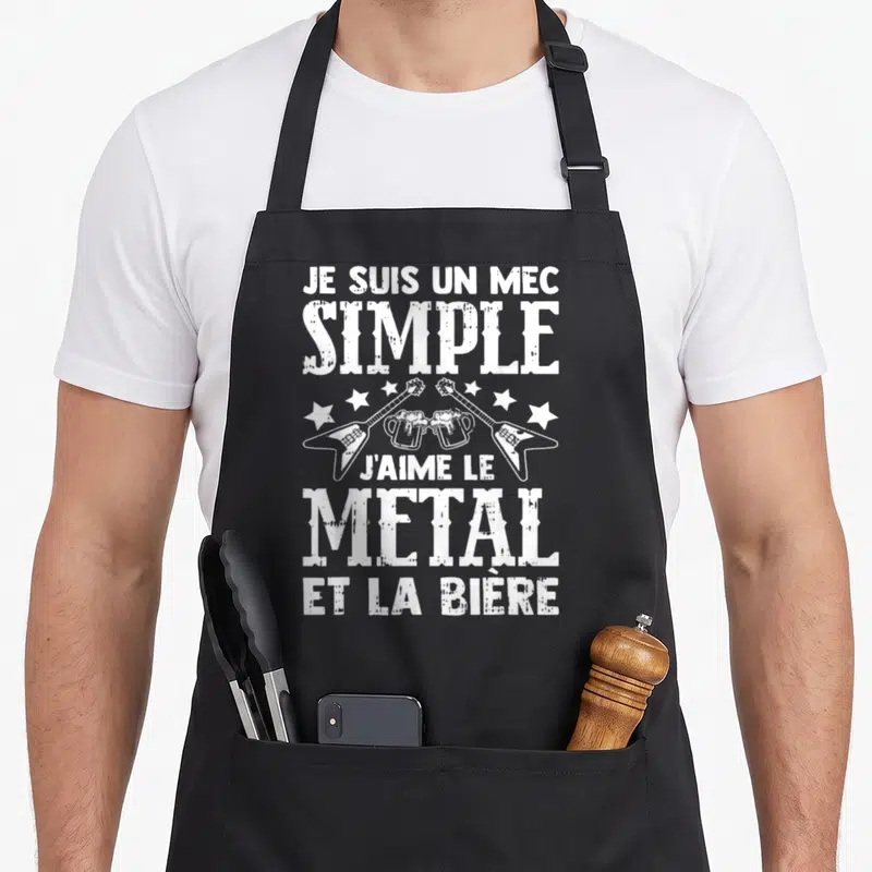 Tablier de cuisine noir avec inscription blanche Je Suis Un Mec Simple J'aime Le Metal Et La Bière et illustration de guitares croisées.