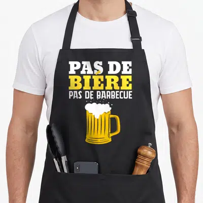 Tablier de cuisine noir avec inscription Pas de bière pas de barbecue et illustration de mug de bière jaune.
