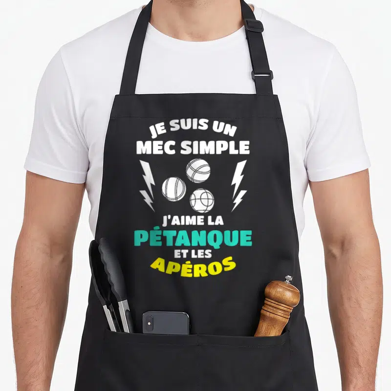 Tablier de cuisine noir avec inscription blanche, trois boules de pétanque et éclairs turquoise et jaune.
