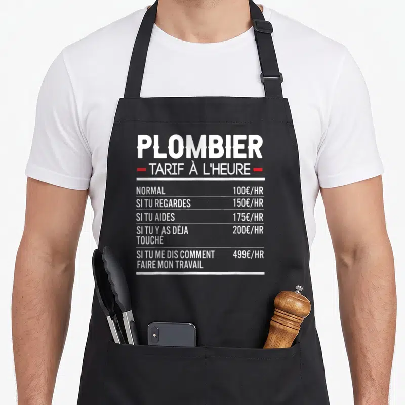 Tablier de cuisine noir avec liste tarifaire humoristique pour plombier en blanc et rouge.
