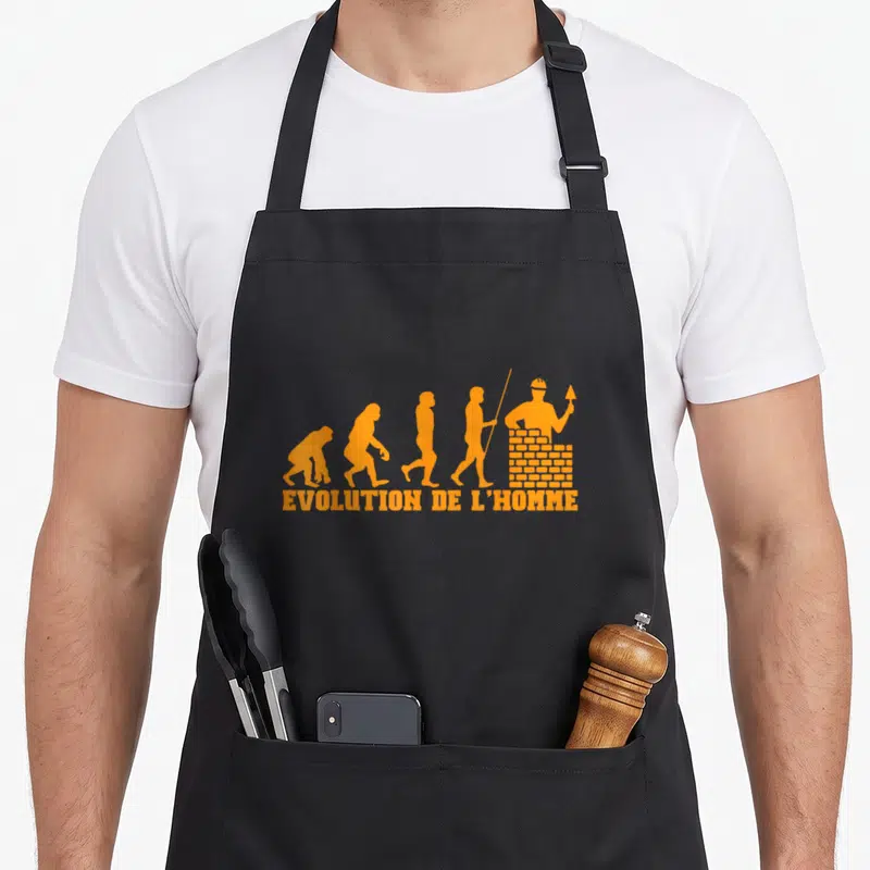 Tablier de cuisine noir avec silhouette orange évolution homme maçon bâtissant mur brique