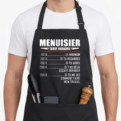 Tablier de cuisine noir avec l'inscription « Menuisier Tarif Horaire » et une liste de tarifs illustrée par des scies.