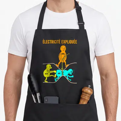 Tablier de cuisine noir avec illustration colorée représentant Volts, Amps et Ohms en pleine dispute électrique.