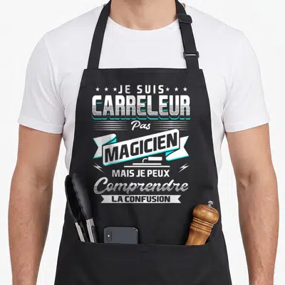 Tablier de cuisine noir avec inscription Je suis carreleur pas magicien mais je peux comprendre la confusion en blanc et turquoise.