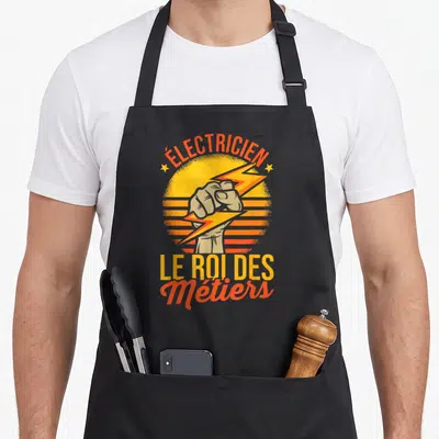 Tablier de cuisine noir avec illustration rétro d'un poing fermant un éclair sur fond orange.