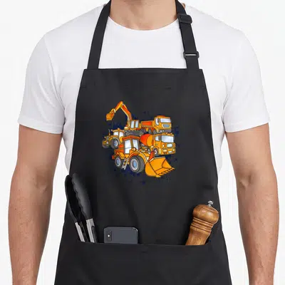 Tablier de cuisine noir avec illustration colorée d'excavatrice, bétonnière et chargeuse sur fond d'éclaboussures bleues.