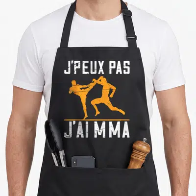 Tablier de cuisine noir avec J'peux pas J'ai MMA et silhouettes orange de combattants
