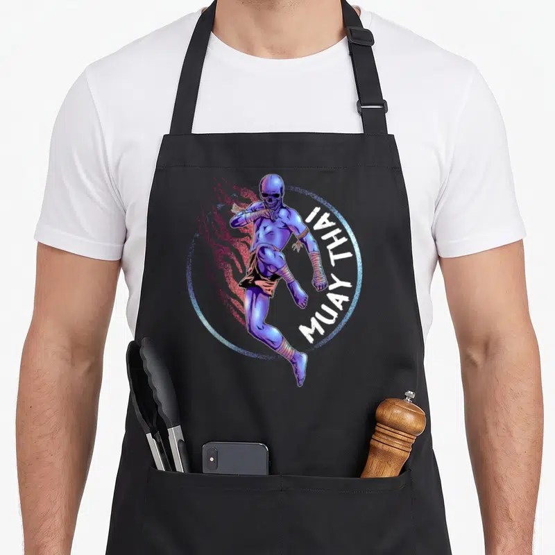 Tablier de cuisine noir avec un squelette violet en train de frapper en Muay Thai, entouré d'un cercle lumineux et du texte Muay Thai.
