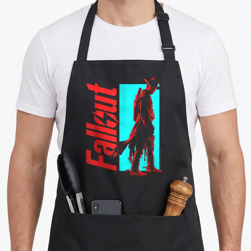 Tablier de cuisine noir avec une silhouette de Ghoul en chapeau et le mot Fallout en lettres rouges stylisées.