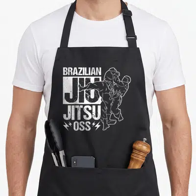 Tablier de cuisine noir avec illustration blanche d'un combattant de Jiu-Jitsu et le texte BRAZILIAN JIU JITSU OSS flanqué de foudres.