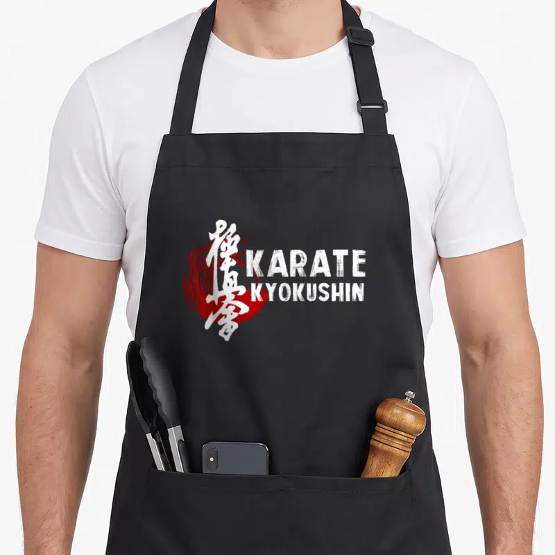 Tablier de cuisine noir avec inscription KARATE KYOKUSHIN et calligraphie japonaise sur cercle rouge.
