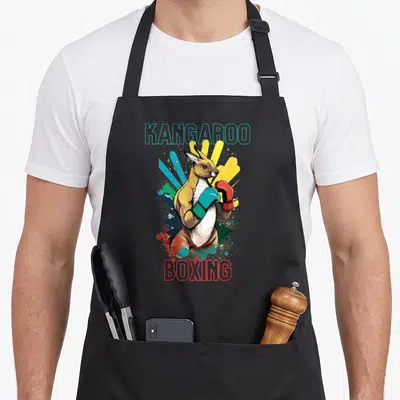 Tablier de cuisine noir avec illustration d'un kangourou en gants de boxe colorés et texte stylisé.