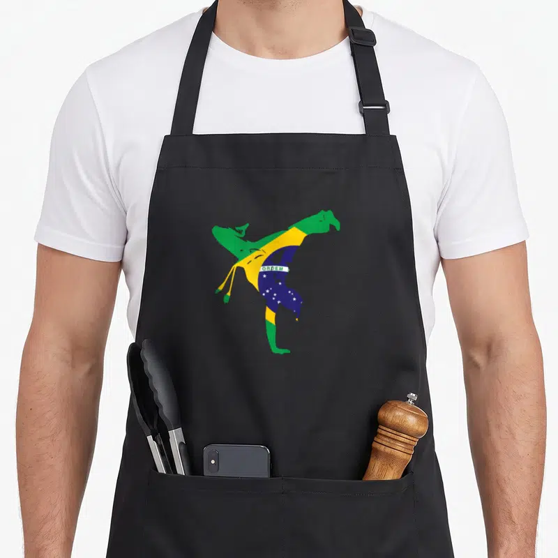 Tablier de cuisine noir avec silhouette capoeira aux couleurs du drapeau brésilien et l'inscription ORDEN, style graphique minimaliste.