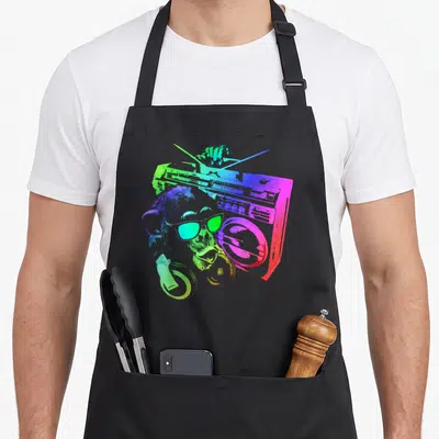 Tablier de cuisine noir avec illustration d'un singe musicien aux couleurs néon tenant une boombox.