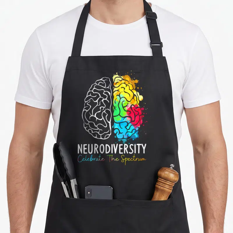Tablier de cuisine noir avec illustration cerveau arc-en-ciel et texte Neurodiversity Celebrate The Spectrum