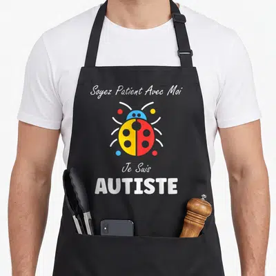 Tablier de cuisine noir avec coccinelle jaune rouge et texte blanc Soyez Patient Avec Moi Je Suis AUTISTE