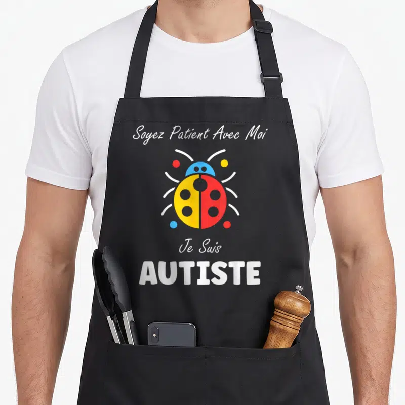 Tablier de cuisine noir avec coccinelle jaune rouge et texte blanc Soyez Patient Avec Moi Je Suis AUTISTE