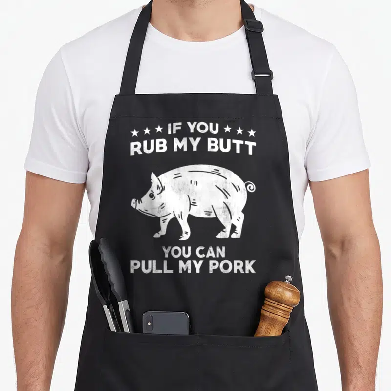 Tablier de cuisine noir avec un cochon blanc et le texte If You Rub My Butt You Can Pull My Pork