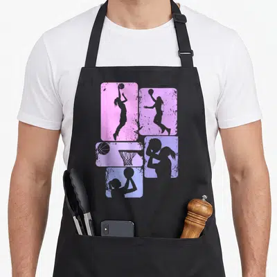 Tablier de cuisine noir avec quatre rectangles rose et violet montrant des silhouettes de joueuses de basketball et un panier.