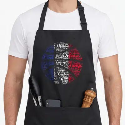 Tablier de cuisine noir avec une illustration typographique représentant un ballon de basket-ball aux couleurs bleu blanc et rouge.