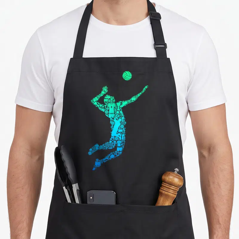 Tablier de cuisine noir avec silhouette de joueur de volley formée d'icônes sportives en dégradé bleu et vert.