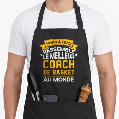 Tablier de cuisine noir avec une inscription jaune et blanche les meilleurs entraîneurs de basket-ball.