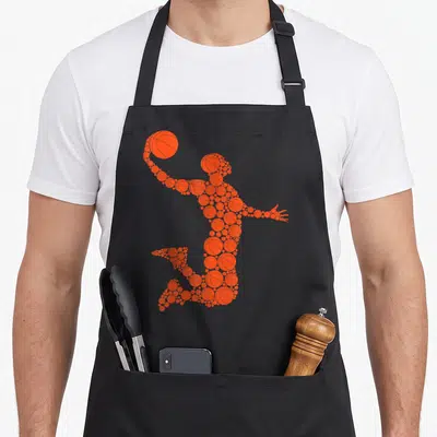 Tablier de cuisine noir avec une silhouette de joueur de basket composée de multiples ballons oranges superposés.