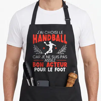 Tablier de cuisine noir avec silhouette handballeur et texte J'ai choisi le handball bon acteur foot en rouge et blanc.