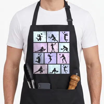 Tablier de cuisine noir avec douze cases colorées montrant des silhouettes de femmes jouant au volley-ball.