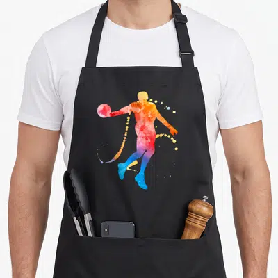 Tablier de cuisine noir avec une silhouette de joueur de basket en aquarelle colorée.